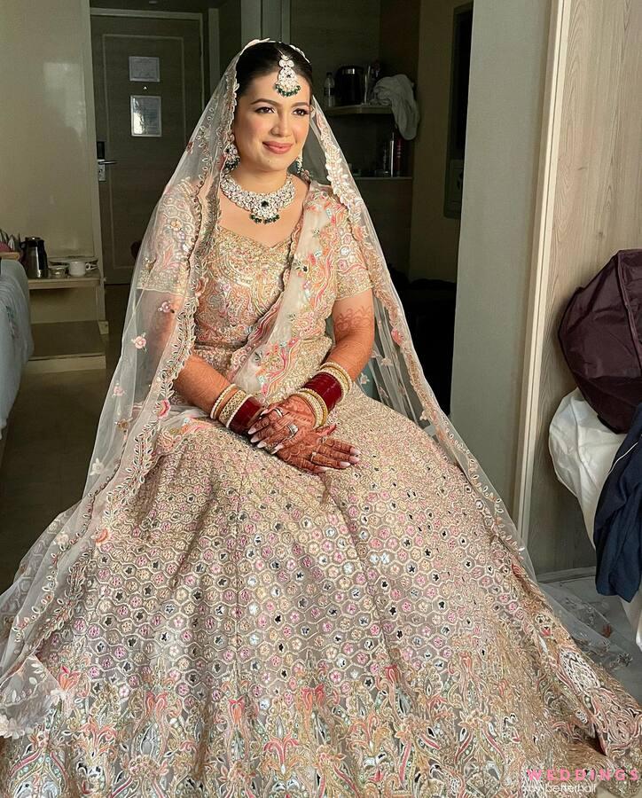 A stunning photo of a bride in a traditional wedding dress, captured in a beautiful hotel room.