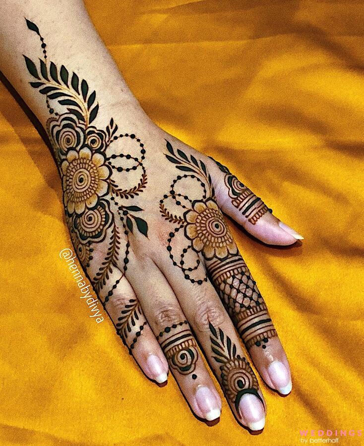 Photo of fancy minimalist back hand mehndi design