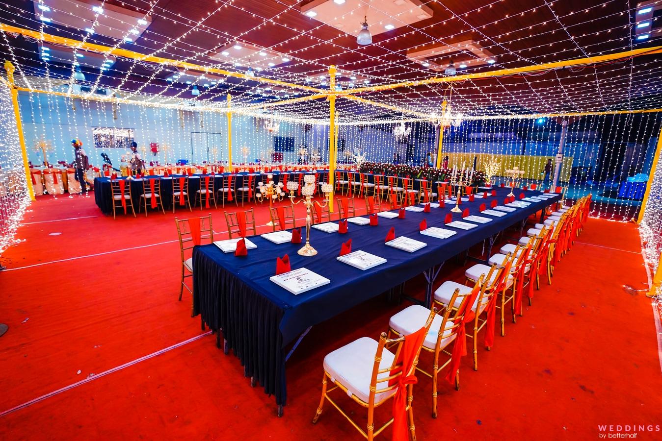 Photo of Fairy Lights Banquet Hall with Navy Blue Table Decor Ideas