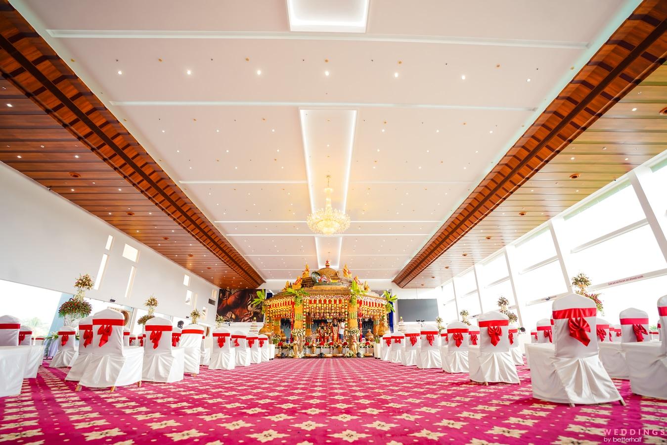 Decoration Ideas - Step into an elegant banquet hall adorned with red and white decorations and a captivating chandelier.
