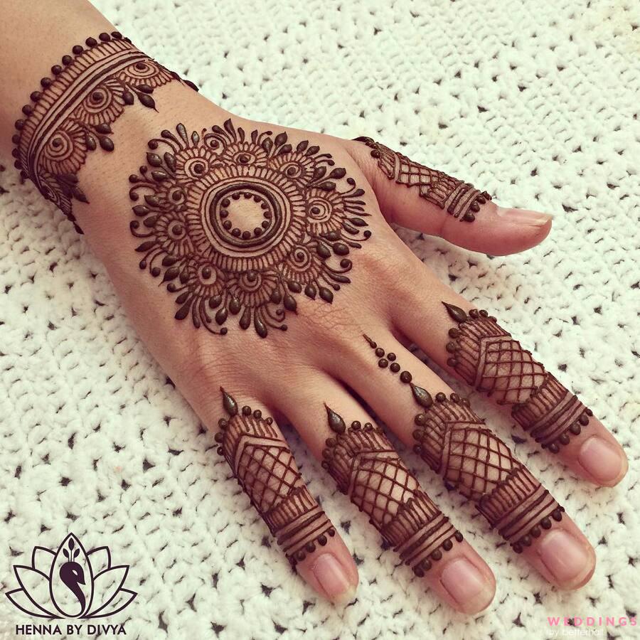 Photo of gol tikki mandala mehndi design on back hand