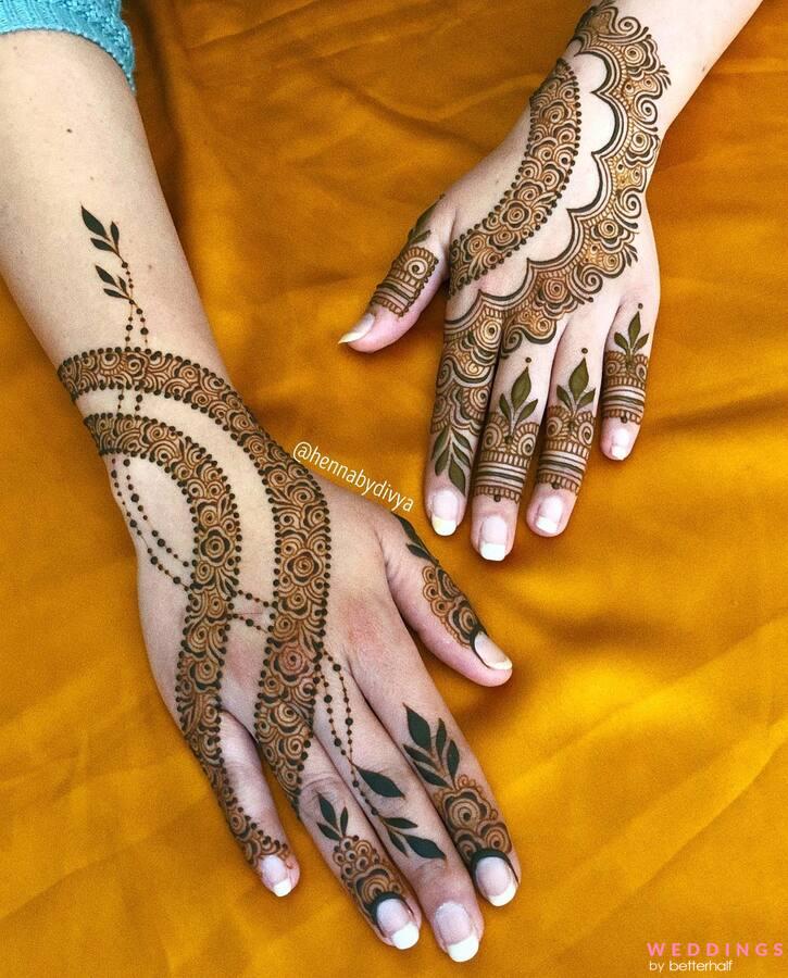 Photo of simple henna patterns for back hand on yellow background