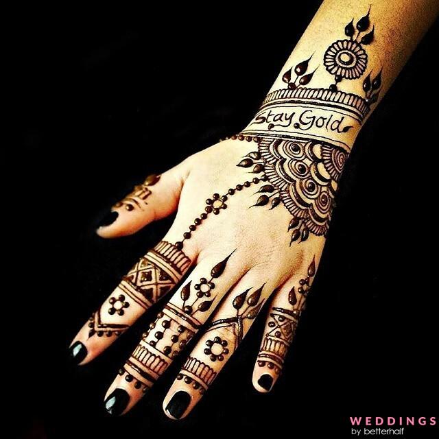 Photo of simple alphabet mehndi design on back hand