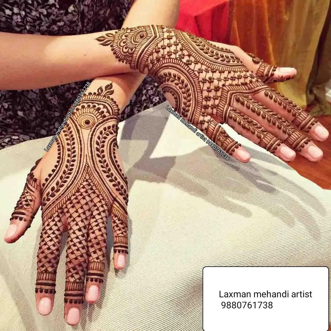 Contrasting Patterns On Both Hands Photo of Contrasting Patterns On Both Hands