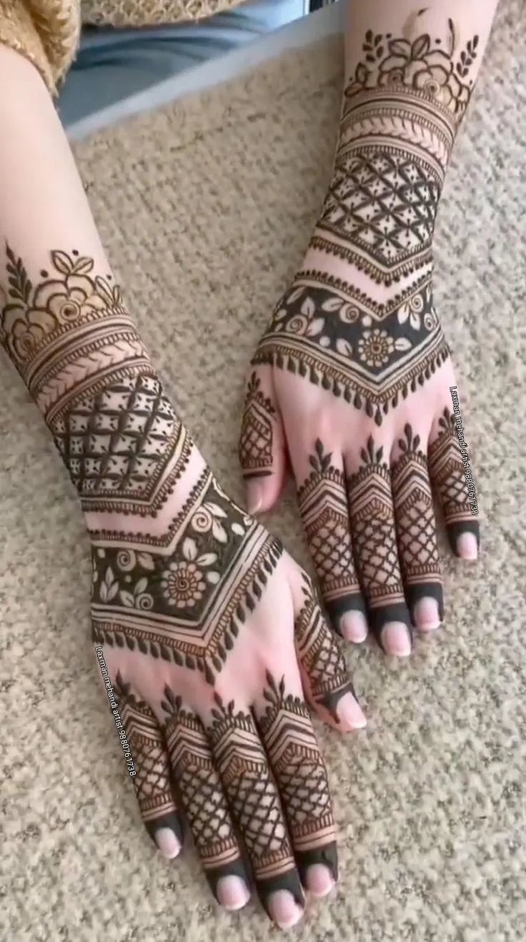 Photo of Decorated Criss-Cross Finger Mehndi Design on back hand