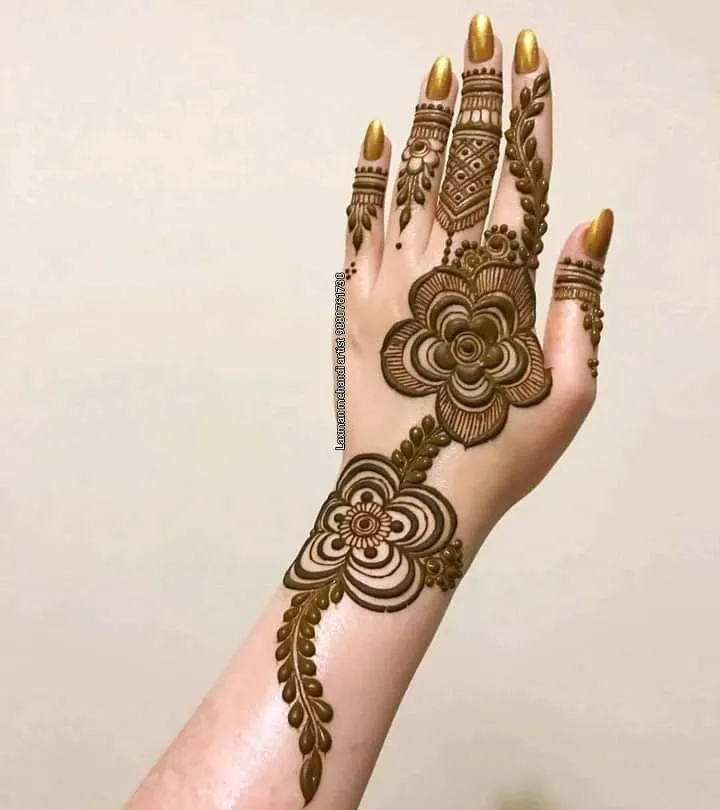 Photo of full back hand  Bel Running Down the Finger mehndi design