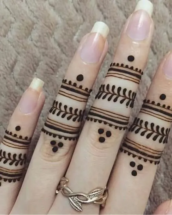 Back of the Finger Henna With Tattoo Touch Photo of Back of the Finger Henna With Tattoo Touch