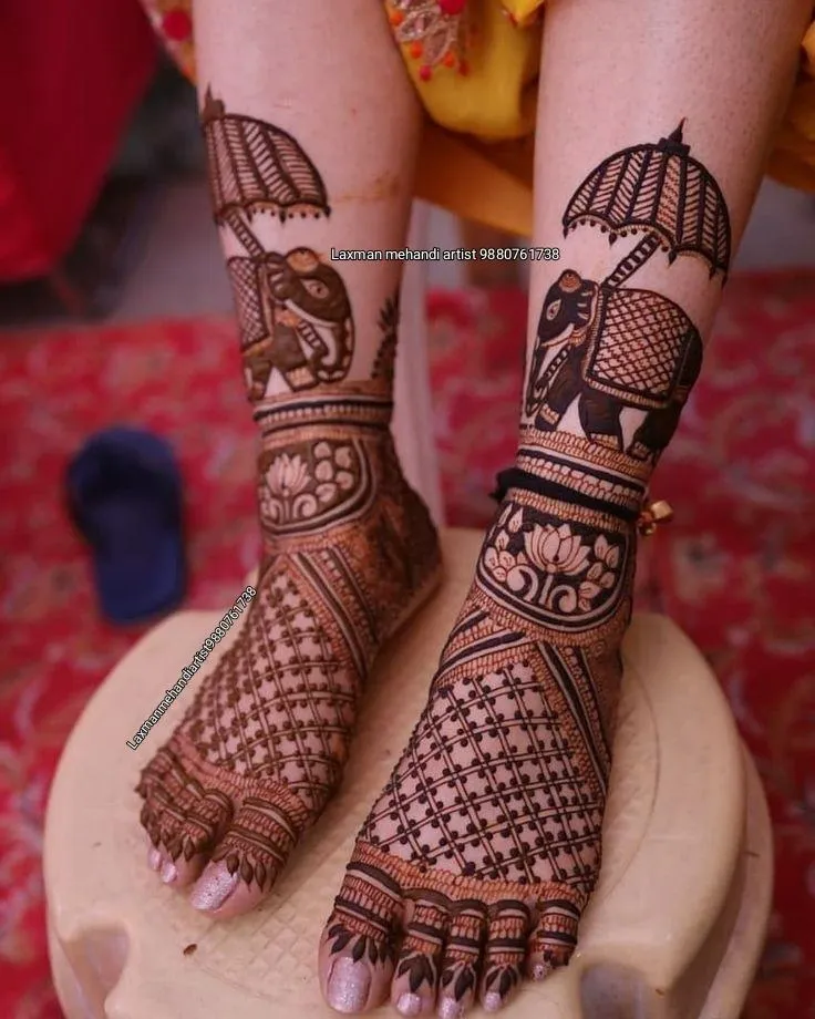 Photo of Enchanting Leaves and Elephant mehndi design on leg and finger