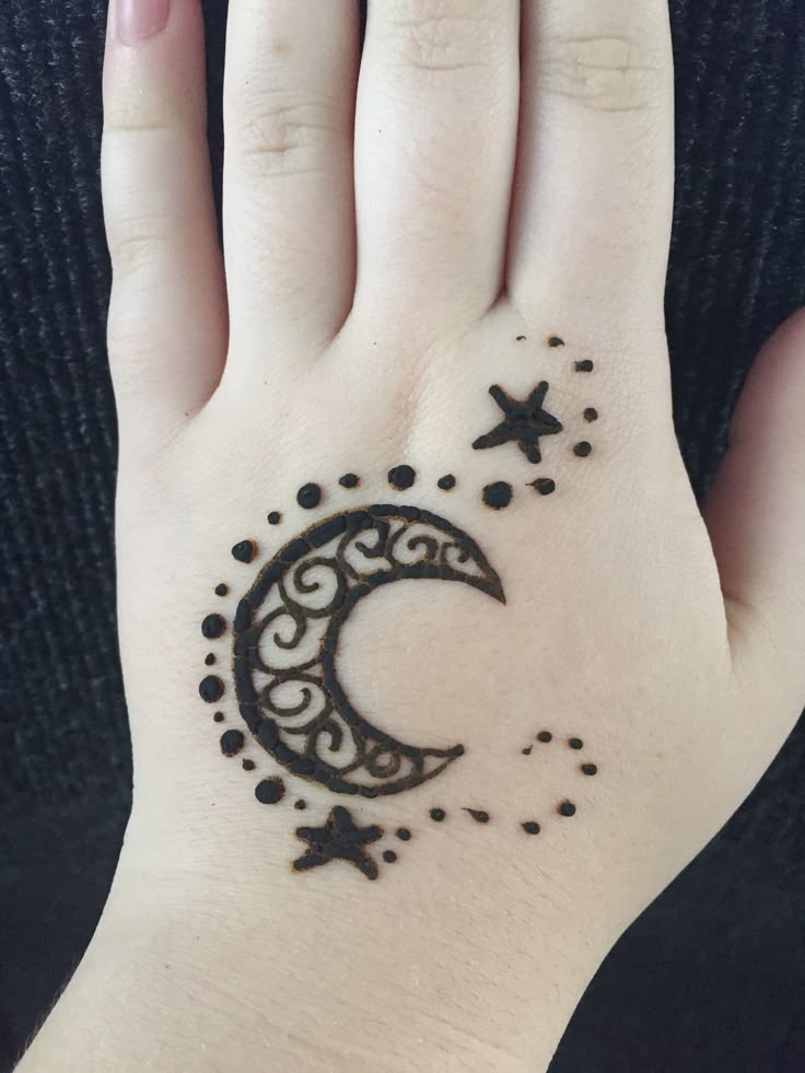 Moon and star mehendi design on kids backhand Photo of Moon and star mehendi design on kids backhand