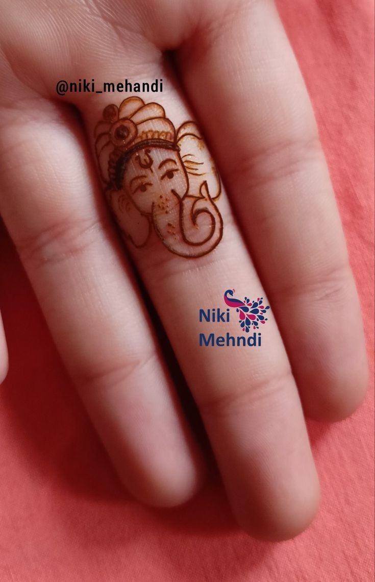 Ganesh Ji Motif Mehndi Design on finger Phot of Ganesh Ji Motif Mehndi Design on finger