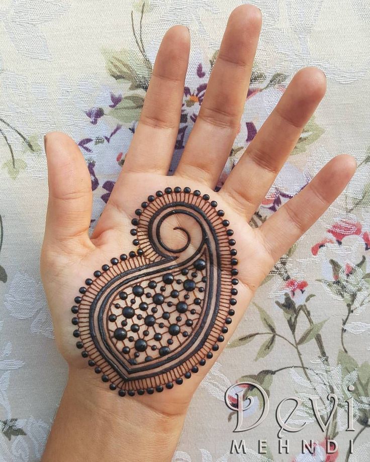 Simple paisley dot mehendi design on front hand Photo of Simple paisley dot mehendi design on front hand