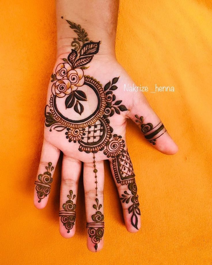 Floral Henna Design on Front Hand Photo of Floral Henna Design on Front Hand