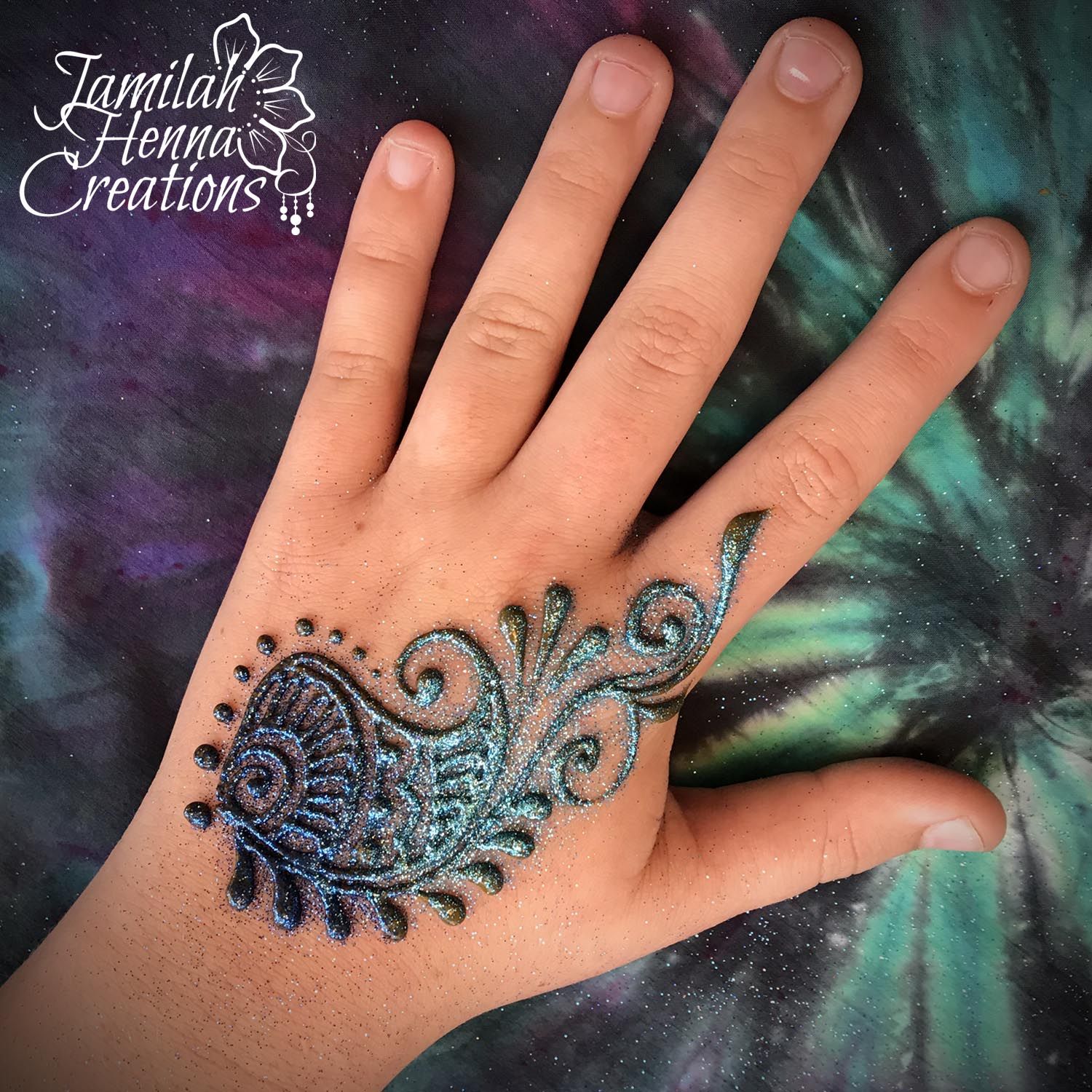 Backhand glitter paisley peacock mehendi design Photo of Backhand glitter paisley peacock mehendi design