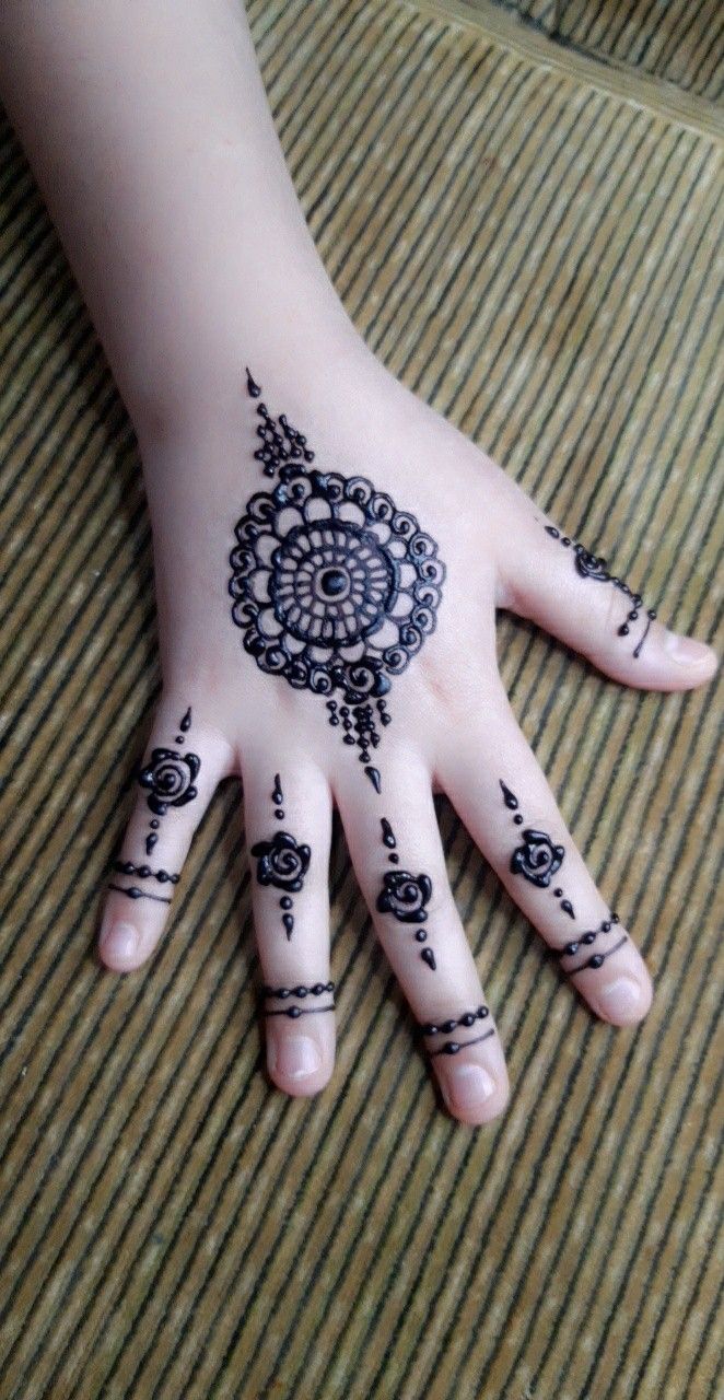 Gol tikka mehndi with Finger Rings on backhand Photo of Gol tikka mehndi with Finger Rings on backhand