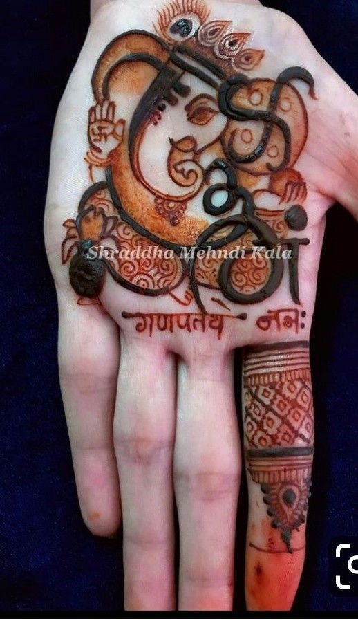Detailed Ganpati Mehendi Design on kids plam hand Photo of Detailed Ganpati Mehendi Design on kids plam hand