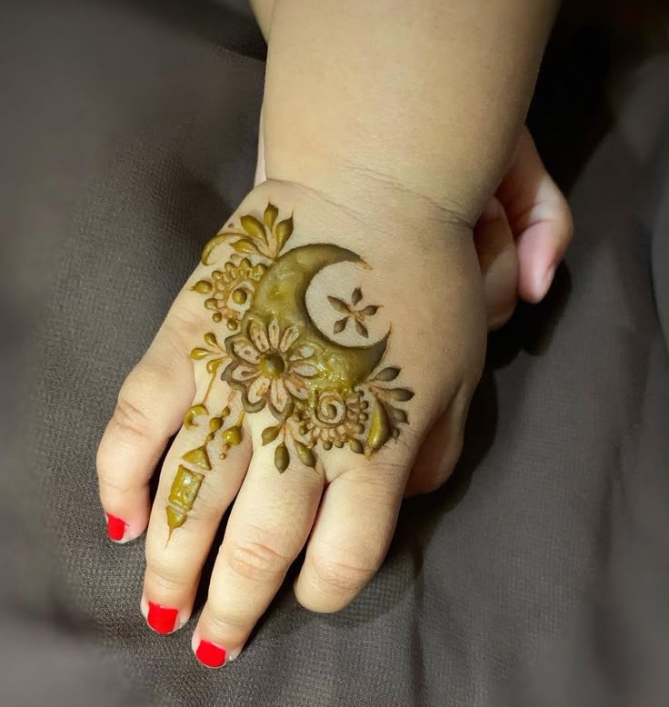 Baby Hand Mehendi with Moon and Floral Motif Photo of Baby Hand Mehendi with Moon and Floral Motif