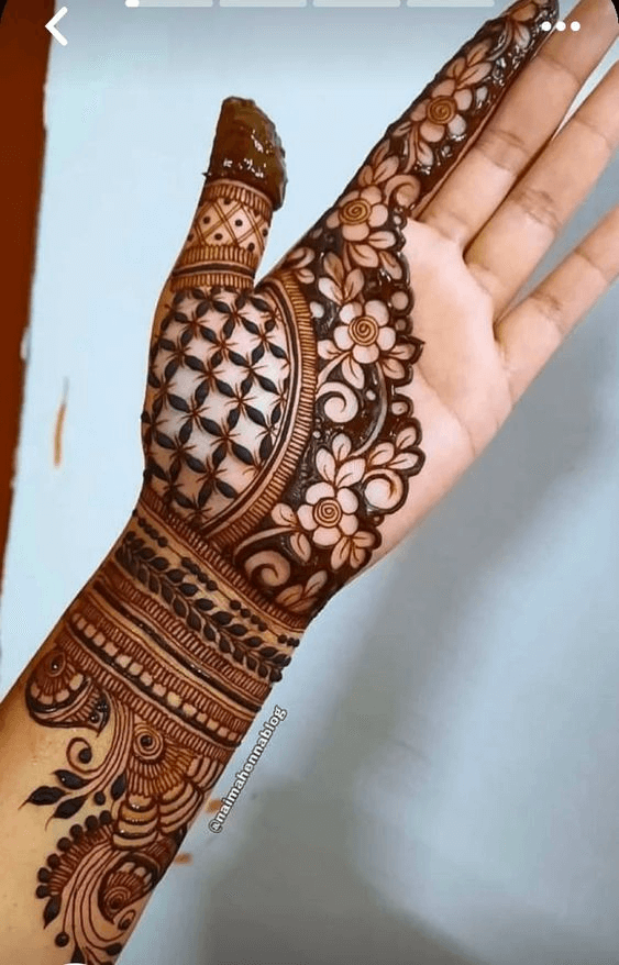 Photo of Half hand mehendi design with thick motifs