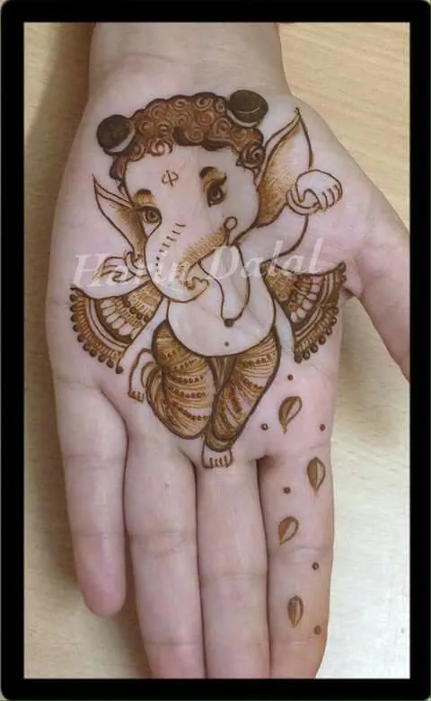 Little ganesh dancing on your palm Photo of Little ganesh dancing on your palm