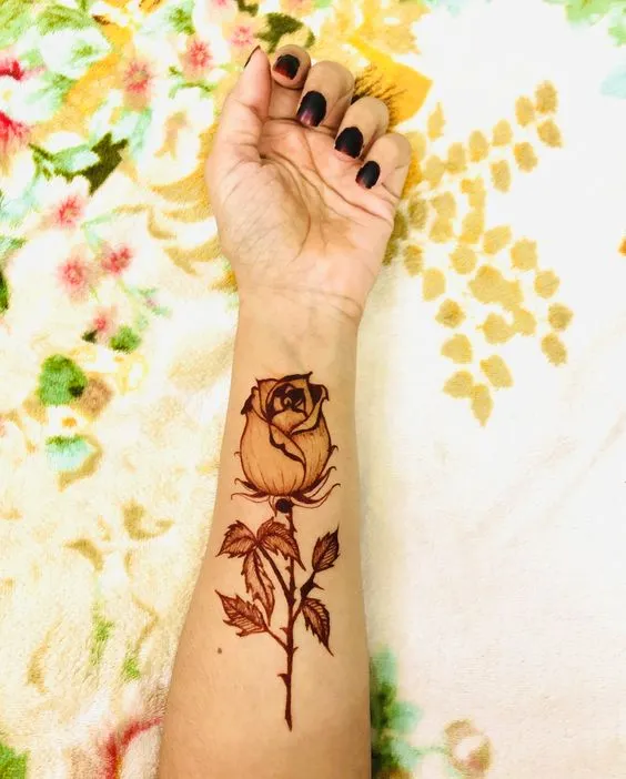 Photo of stunning 3D rose mehndi design on wrist