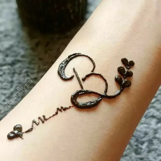Initial Mehndi Art On Wrist Photo of Initial Mehndi Art On Wrist