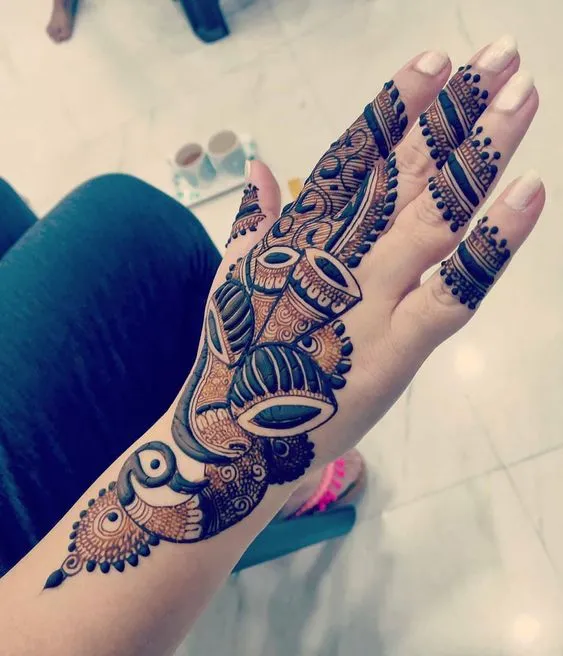 wedding mehndi design on backhand Photo of Peacock and Dholak Back-Hand Mehndi