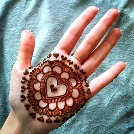 Photo of Heart mehndi design in mandala mehndi pattern