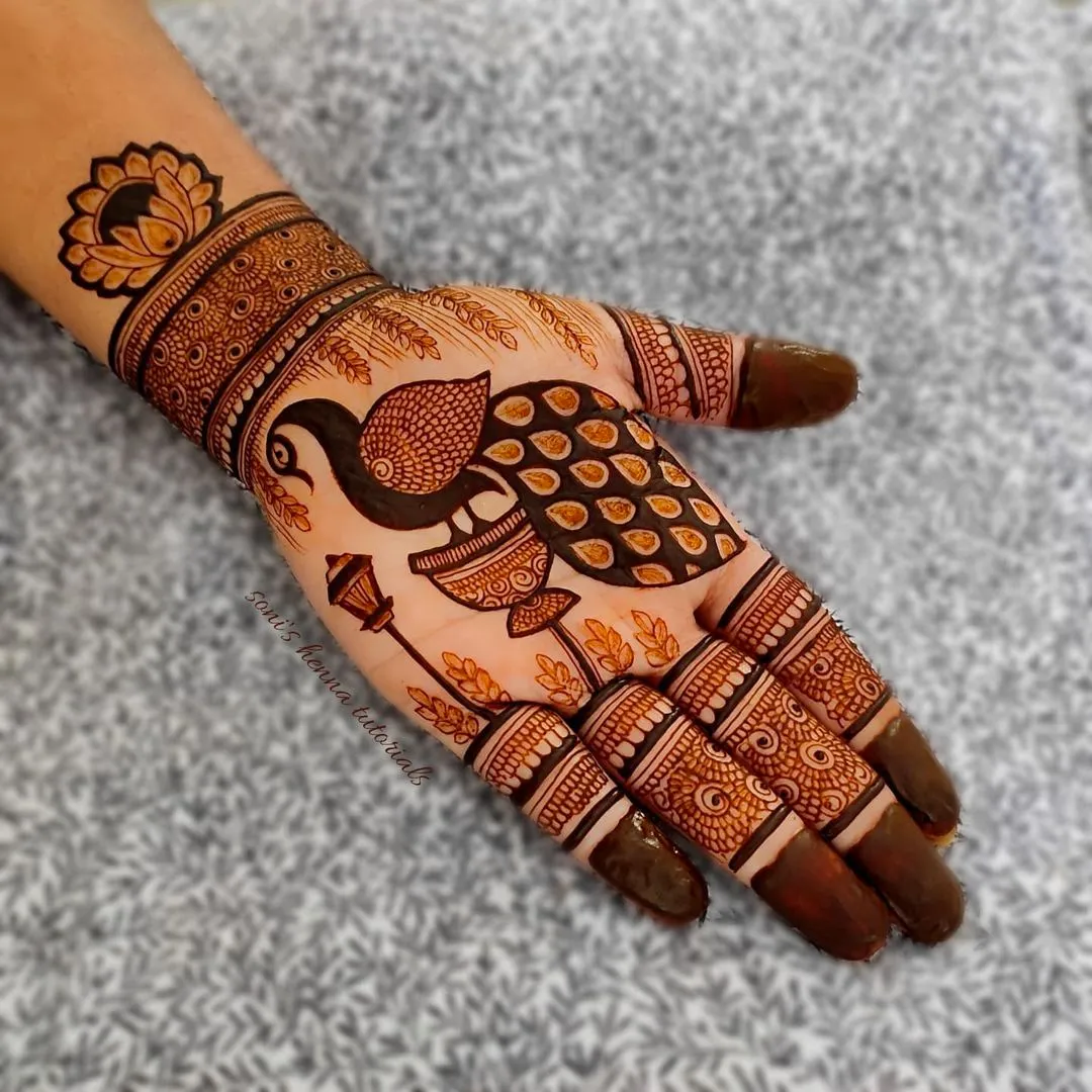 Photo of Simple Full Hand Peacock Mehndi Design