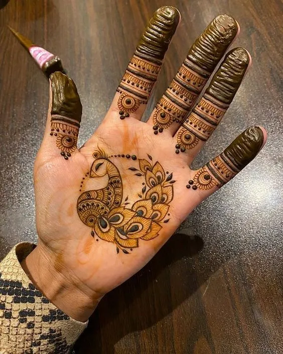 Photo of Peacock mehndi on palm hand