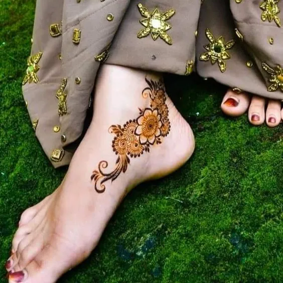 Photo of stunning ankle mehendi design