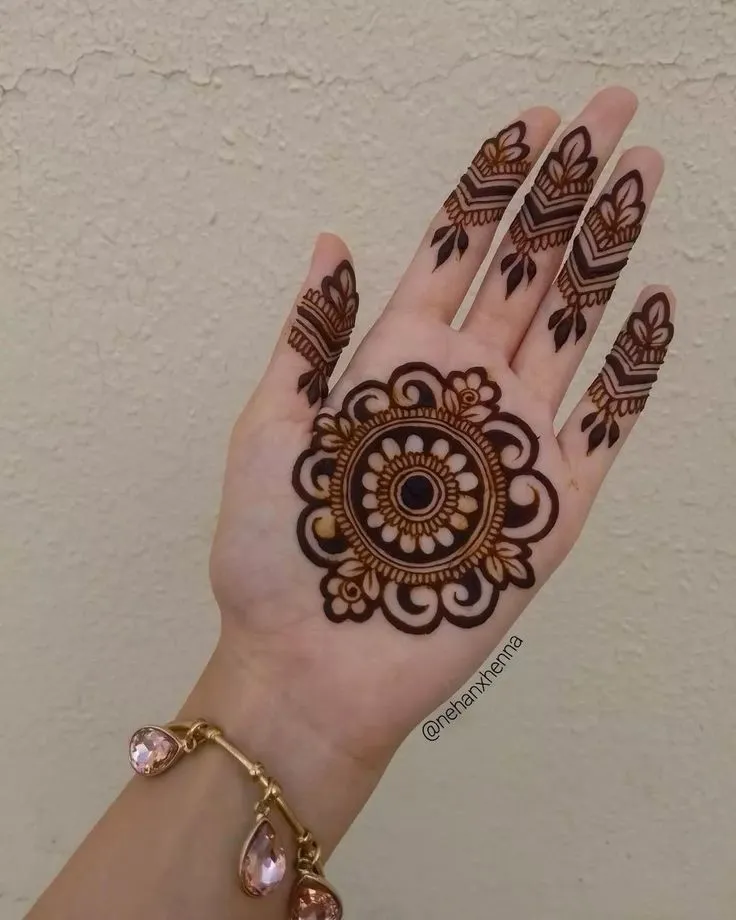 Photo of Simple mandala mehndi design with limited artistry