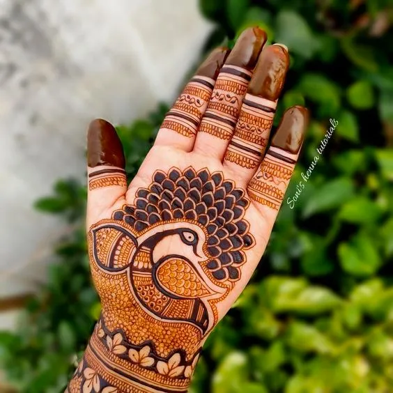 Photo of Peacock mehndi design on front hand