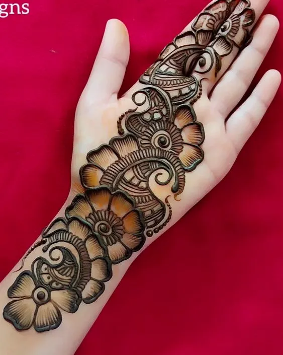 Photo of Front hand Arabic tattoo mehndi design