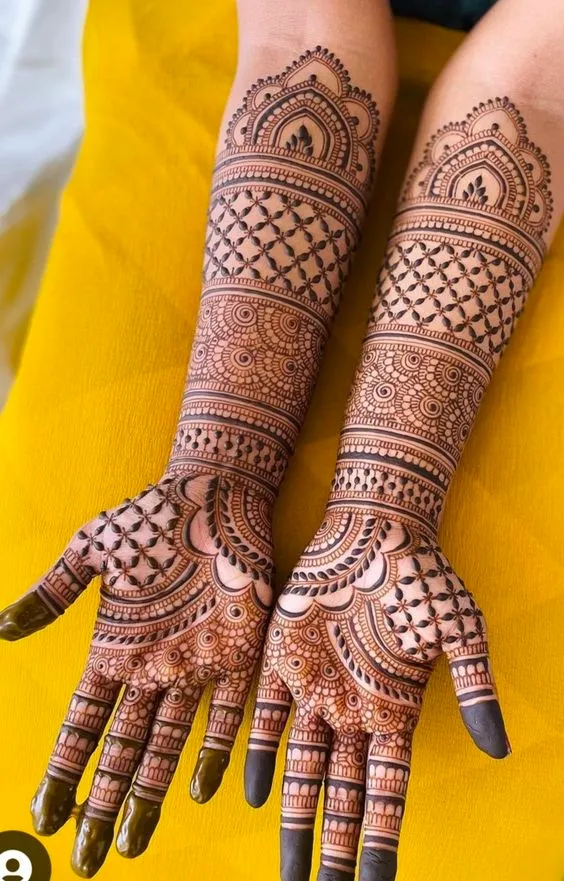 Red tattoo mehndi design on full front hand Photo of red tattoo mehndi design on full front hand