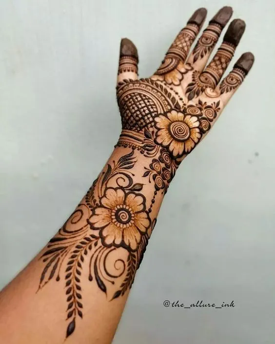 Photo of Floral Tattoo Mehndi Design from wrist to fingertips!